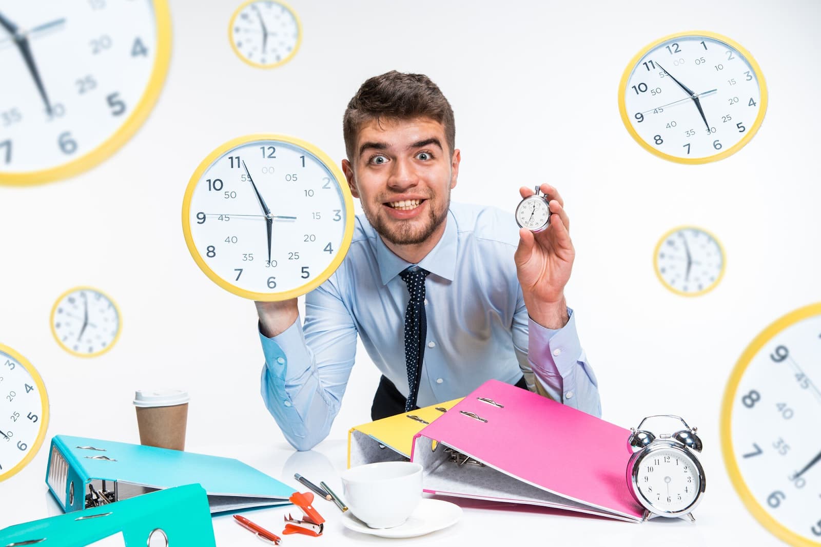 Guy among the clocks in the office