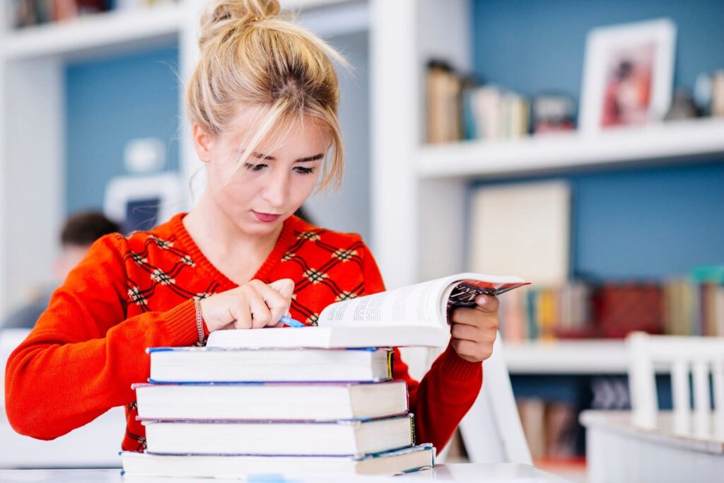 Young woman studying in library