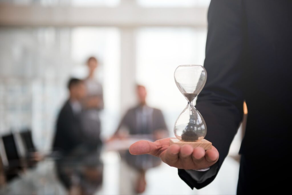 Businessman holding an hourglass